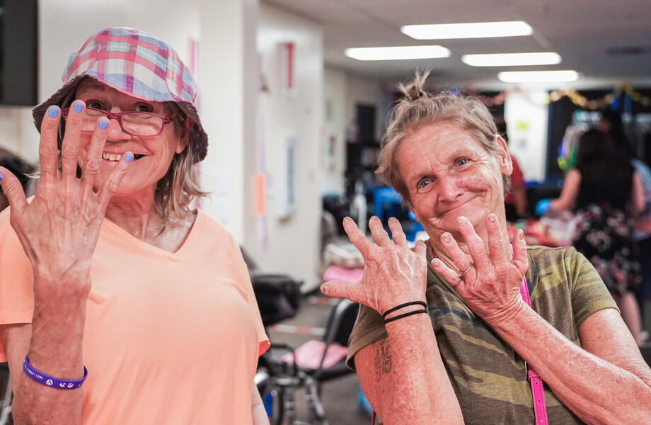 Two guests show off their new bling at the birthday.