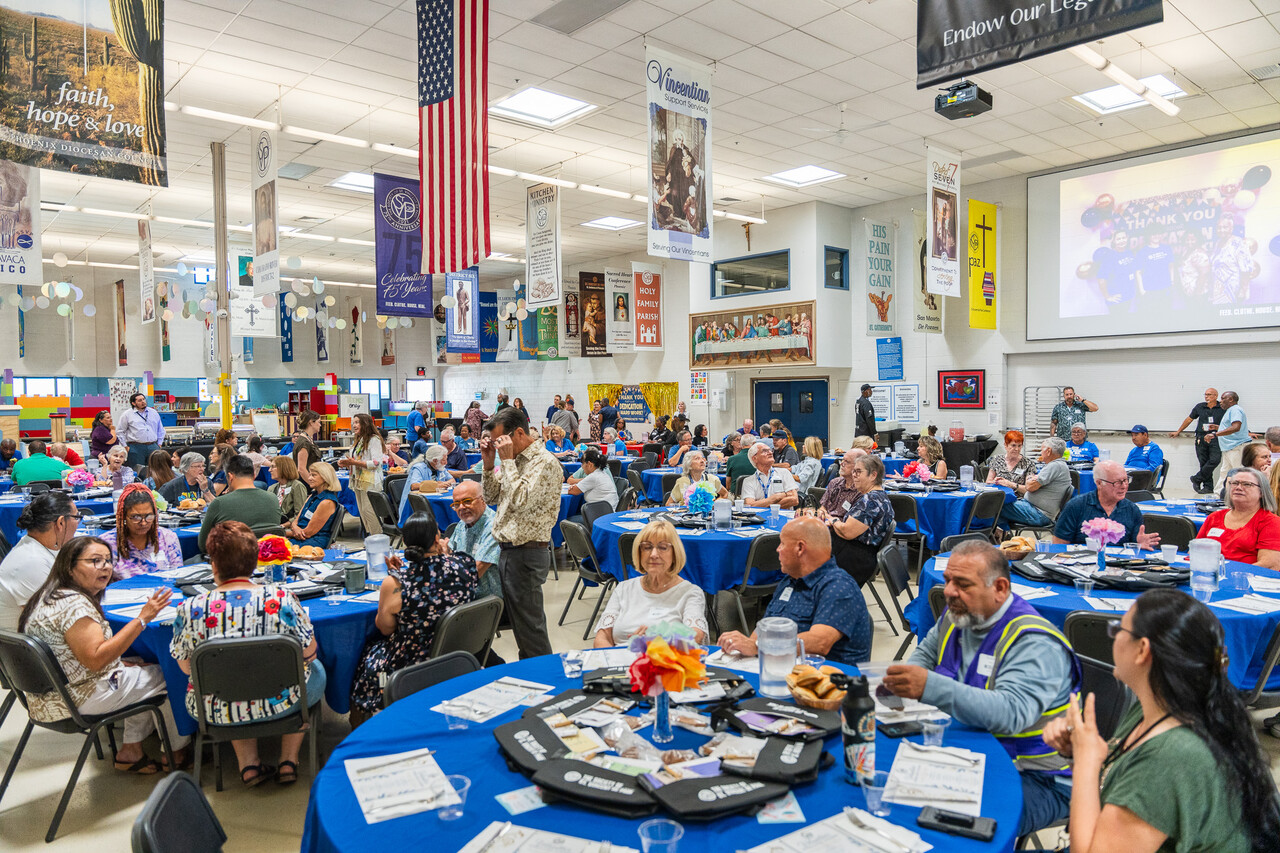 The crowd mingles during the luncheon.