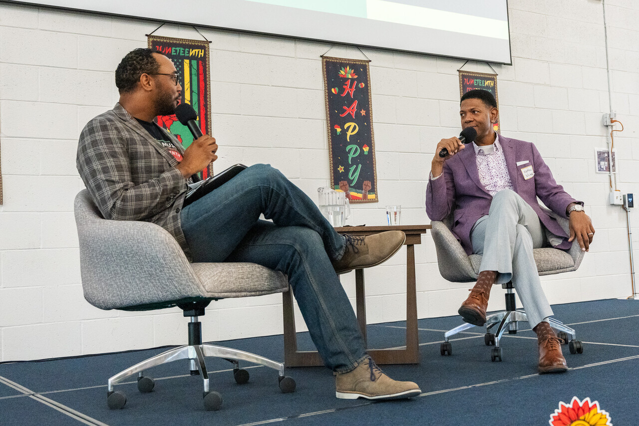 Xavier hosts a Q&A with Dr. Whitaker on stage.