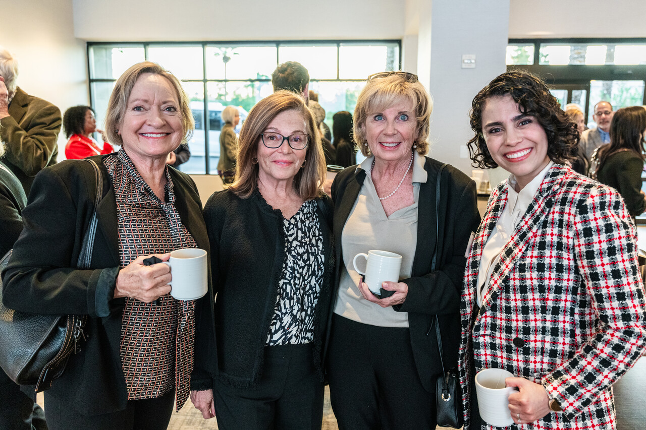 A group of womens posing at the Restoring Hope Community Breakfast