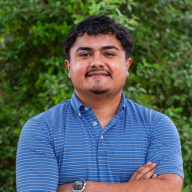 Alejandro poses for a headshot.